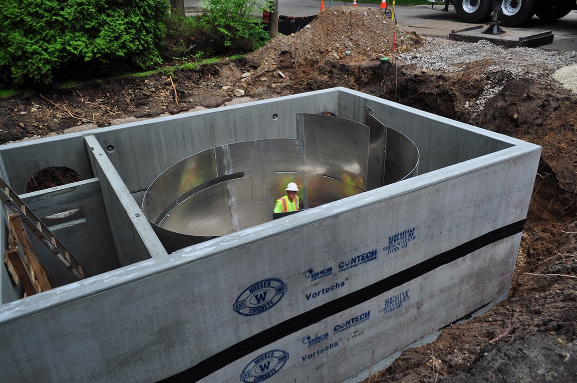 Construction worker inside a large concrete box