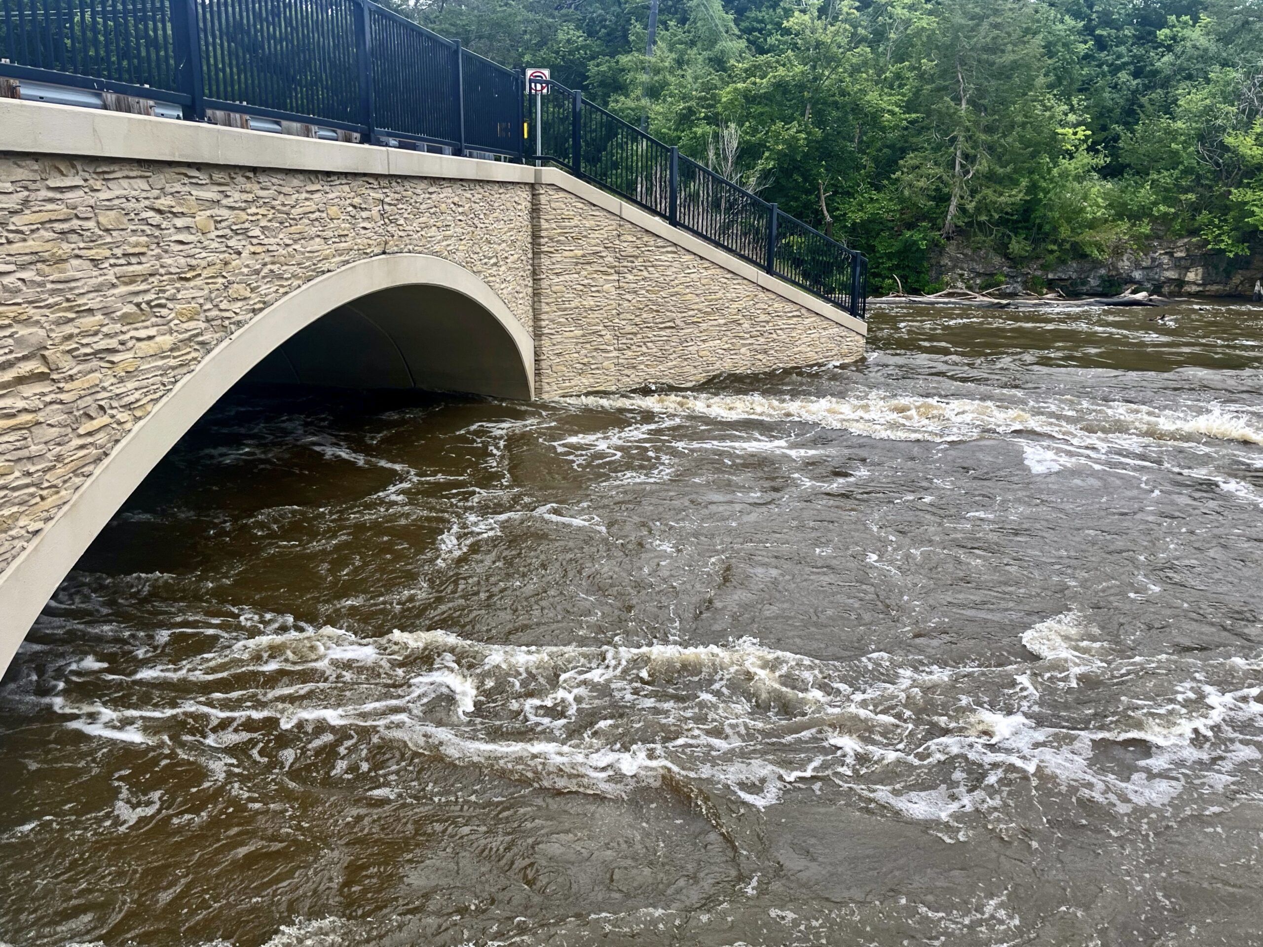 View of water flowing under a bridge
